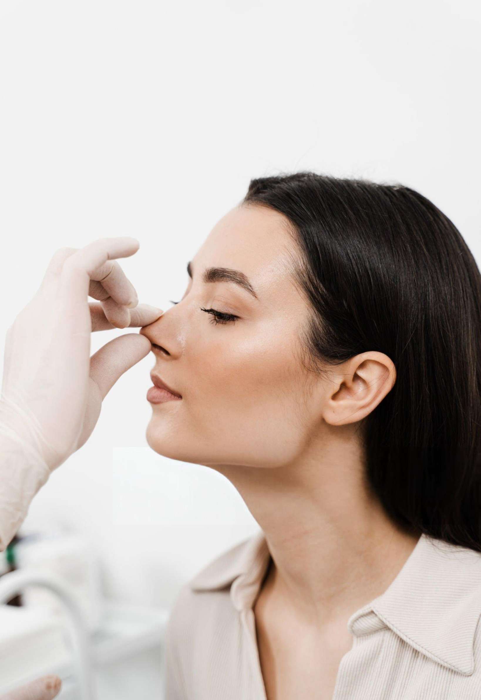 Professional non-surgical rhinoplasty treatment being administered